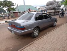 A perfectly sound, grey blue Toyota Corolla 1997 DX, tinted 